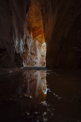 Reflection from a puddle at the bottom of the antique underground reservoir in NP Zippori, Galilee, Israel