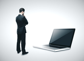 Businessman looking on laptop