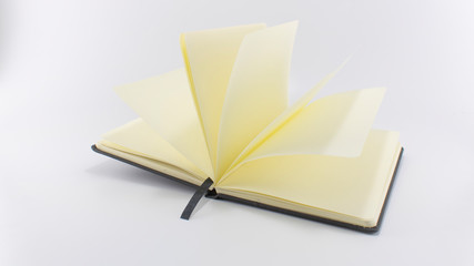 Open book on white background, top view. Space for text. Close up.
