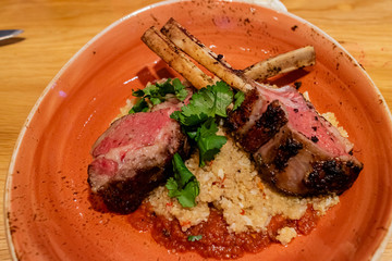 Close up shot of a plate of delicious fried Lamb chops