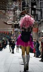 drag queen posing on the street in a parade