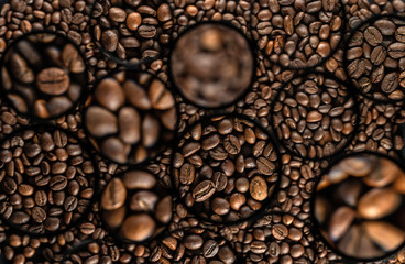 Background of roasted coffee beans in circles in different sizes.