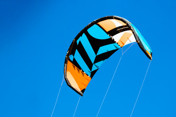 kite filled with the wind against a blue sky background