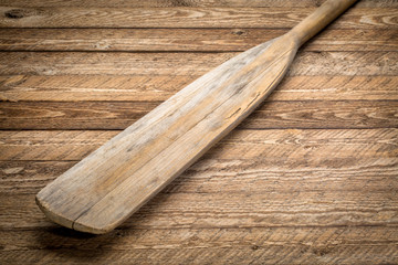 blade of vintage wooden canoe paddle