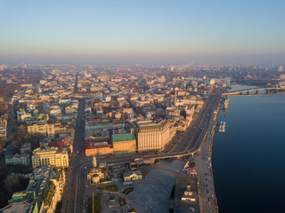 Aerial drone view. View of the Dnieper River and the Podil district in Kiev in the early morning.