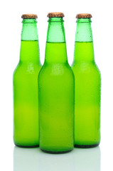 Three Lemon Lime Soda Bottles on White