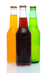 Three Assorted Soda Bottles on White