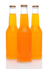Three Orange Soda Bottles on White