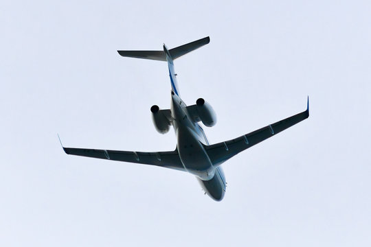 Low angle view of a small jet plane in flight