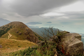 Lantau island is not far from Hong Kong, but the path to Lantau peak is very difficult, especially in winter with wind and fog. The reward for climbing is stunning views from the top of the mountain.