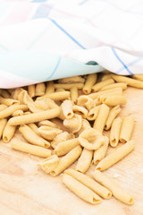 Homemade raw apulian pasta background of italian pasta called Orecchiette and Maccheroni, typical dish of Southern Italy, Puglia, Salento