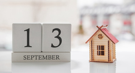 September calendar and toy home. Day 13 of month. Card message for print or remember