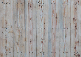 old wooden background with nailed nails