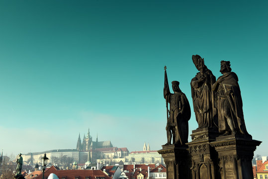 Statues of Saints Norbert, Wenceslaus and Sigismund on Charles Bridge in Prague, Czech Republic. Medieval Gothic bridge, finished in the 15th century, crossing the Vltava River