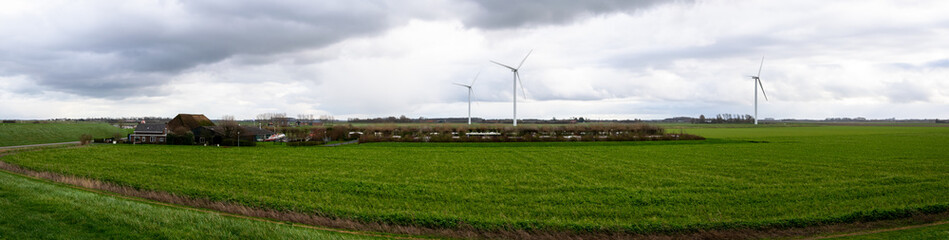 Fototapeta na wymiar Horizontal panoramic view farm wind turbine
