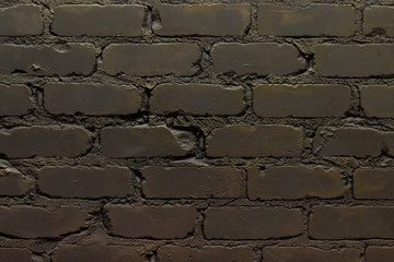 old wall of bricks with cracks