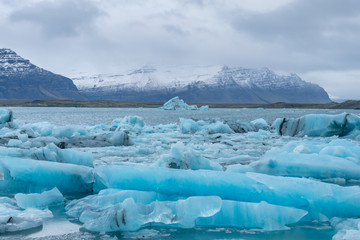 Deep blue icebergs in Jokulsarlon glacier lagoon