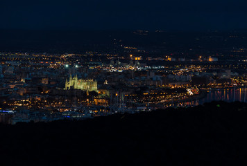 Fototapeta na wymiar Mallorca, spain, December 12 2016: The Cathedral and the Bay of Palma de Mallorca at night
