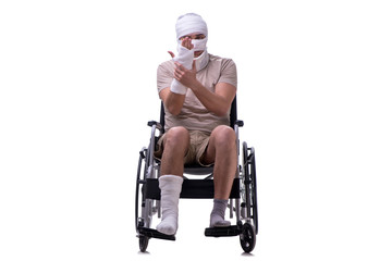 Injured man in wheel-chair isolated on white