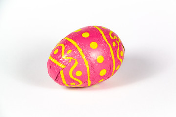Chocolate egg wrapped in pink paper for easter