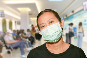 Portrait Asian Thai woman wear face medical protection hygienic mask wait for disease examination...