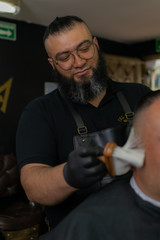 Latin American barber working the style with a long beard in the city of Bogotá.