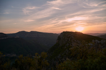 Fototapeta na wymiar Sunset between the big mountains in summer