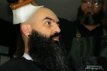 Latin American barber working the style with a long beard in the city of Bogotá.
