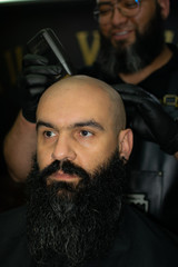 Latin American barber working the style with a long beard in the city of Bogotá.