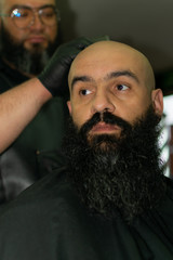 Latin American barber working the style with a long beard in the city of Bogotá.