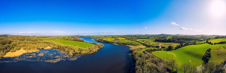 panorama aerial  view of sunny quoile river  winter countryside in Downpatrick,Northern Ireland