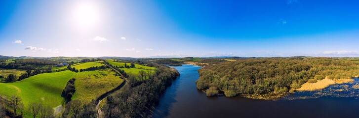 Naklejka premium panorama aerial view of sunny quoile river winter countryside in Downpatrick,Northern Ireland