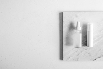 cosmetic skincare packaging . beauty product mock up on luxury white marble with natural light and shadow.