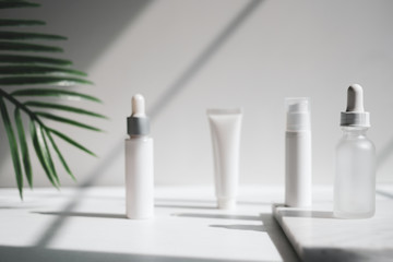 cosmetic skincare packaging . beauty product mock up on luxury white marble with natural light and...