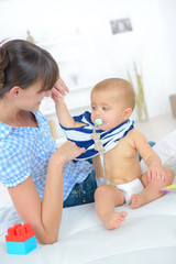 changing the baby after it puke