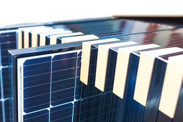 Installing solar photovoltaic panel system. Solar panel technician installing solar panels on roof....