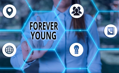 Handwriting text Forever Young. Conceptual photo mindset of a being fresh and carefree no matter...