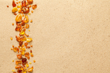 Ambers On Sea Sand Background