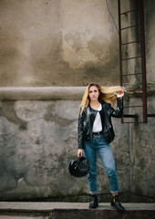 Fototapeta na wymiar young woman posing in old town