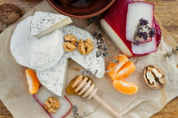 camembert, brie, gouda cheese served on the table