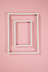 White frames on pink background and some shadows