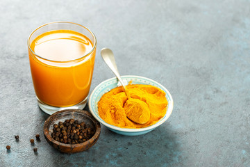 Turmeric with water and black pepper. Healthy eating. Space for a text