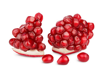 Pomegranate pieces isolated on white background with clipping path and full depth of field.