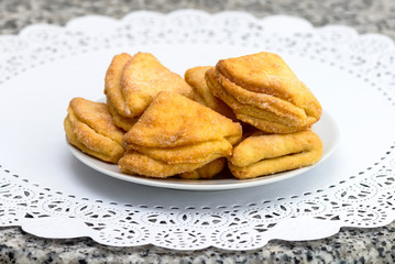Homemade cheese biscuits with sugar on a white napkin