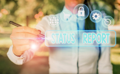 Writing note showing Status Report. Business concept for document relating a situation of something such as a project