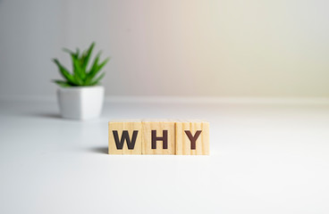 Letter block in word why on wood background