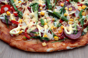 Pizza on wooden background. top view. Pizza Margarita with arugula, seafood, sausages, greens, corn, Cheese