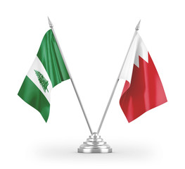 Bahrain and Norfolk Island table flags isolated on white 3D rendering