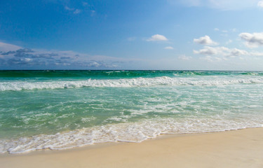 Fototapeta na wymiar Tidal waves rolling onto shore