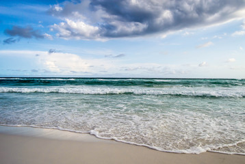 Graceful waves flowing onto the shore